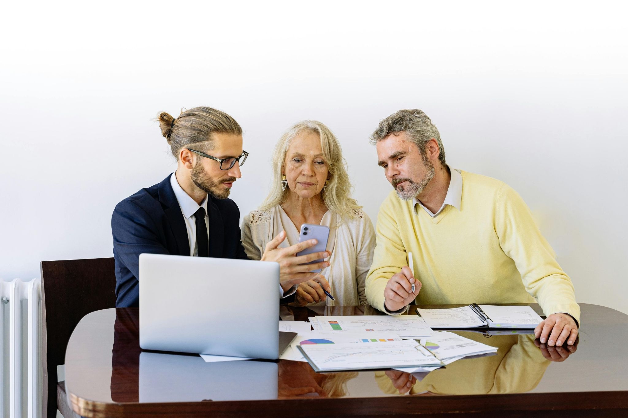 three people in a meeting