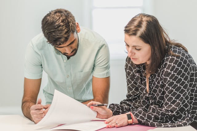 people-looking-at-papers-in-home